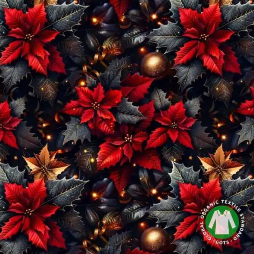 Genkei Christmas Flower julekjolen i blød økologisk bomuldsjersey. Rødt og gyldent julemotiv, firkantet udskæring, praktiske lommer og et flatterende skørt.